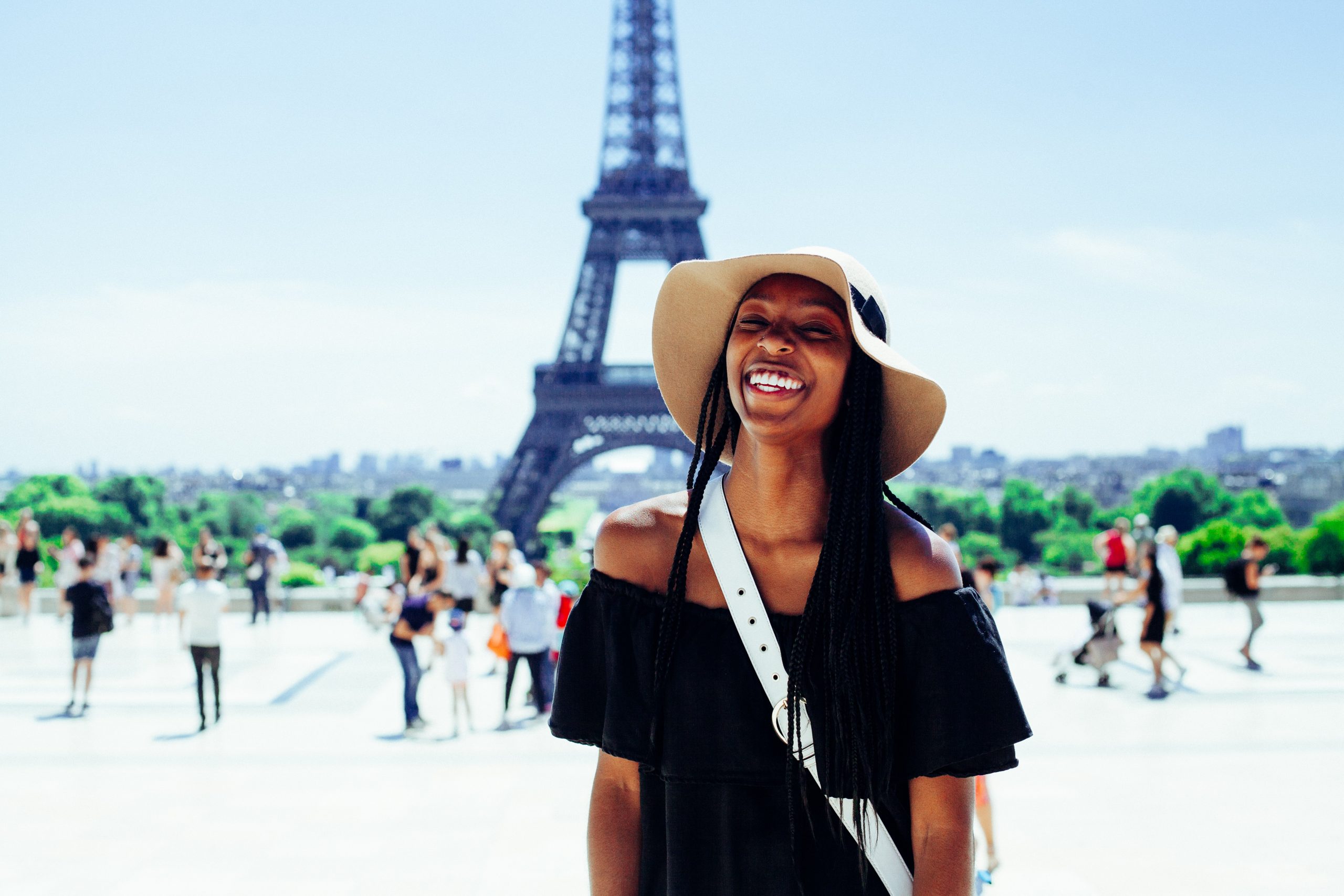 woman smiling in front of Eiffel Tower
